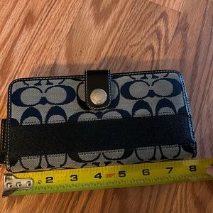 Coach black and grey wristlet wallet.